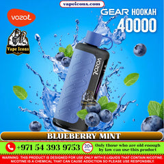 Vozol Gear Hookah 40000 with blueberries and mint leaves on a blue background