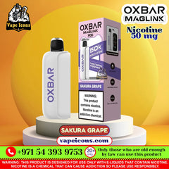 Oxbar Maglink PDD vape device in Sakura Grape flavor, shown next to its retail packaging box on a white pedestal against a yellow and orange gradient background. The image features multiple brand watermarks and promotional text overlays.